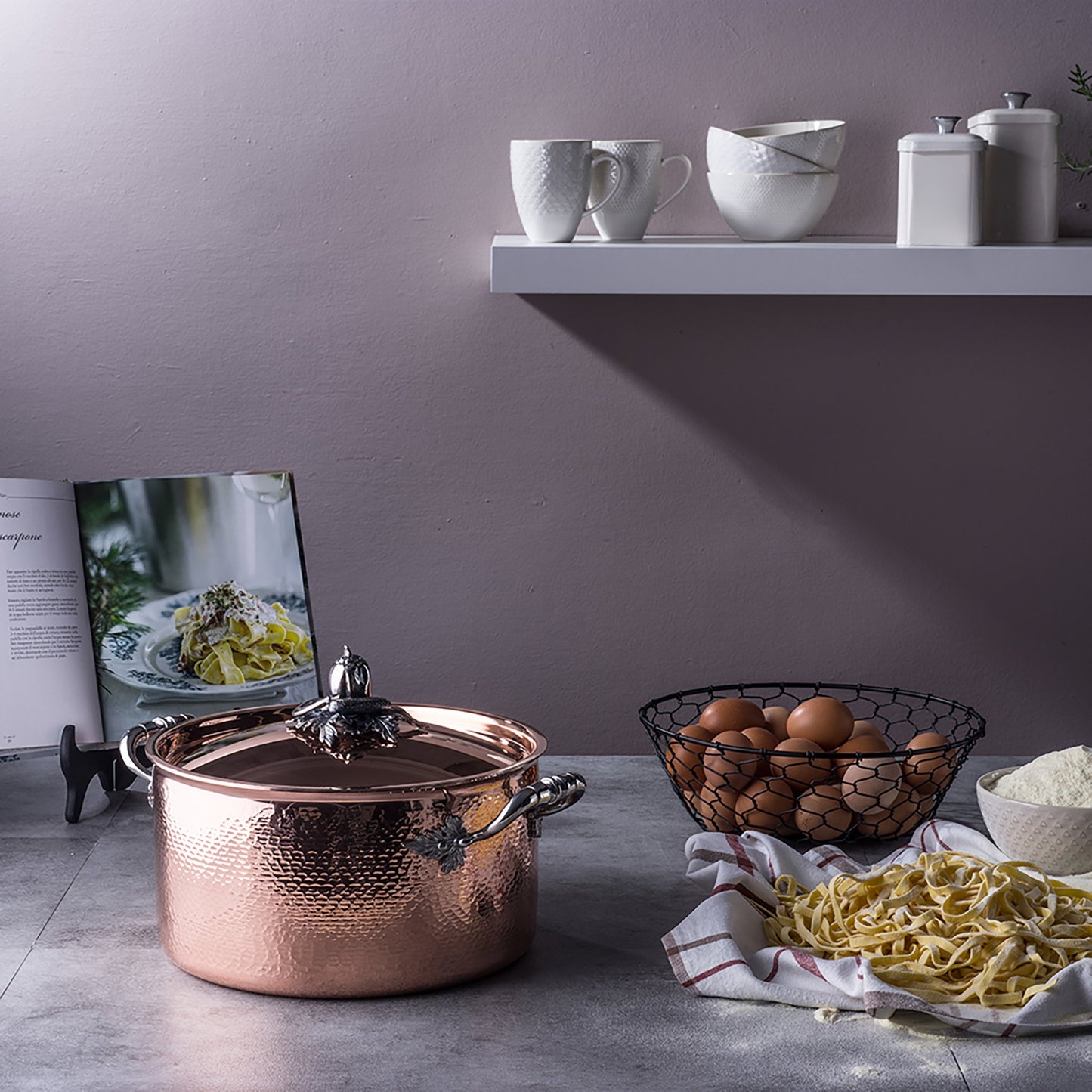 Opus Cupra stockpot in the kitchen with fresh pasta, flour, and eggs