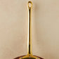 Beautiful bronze long stick handle on Historia cookware