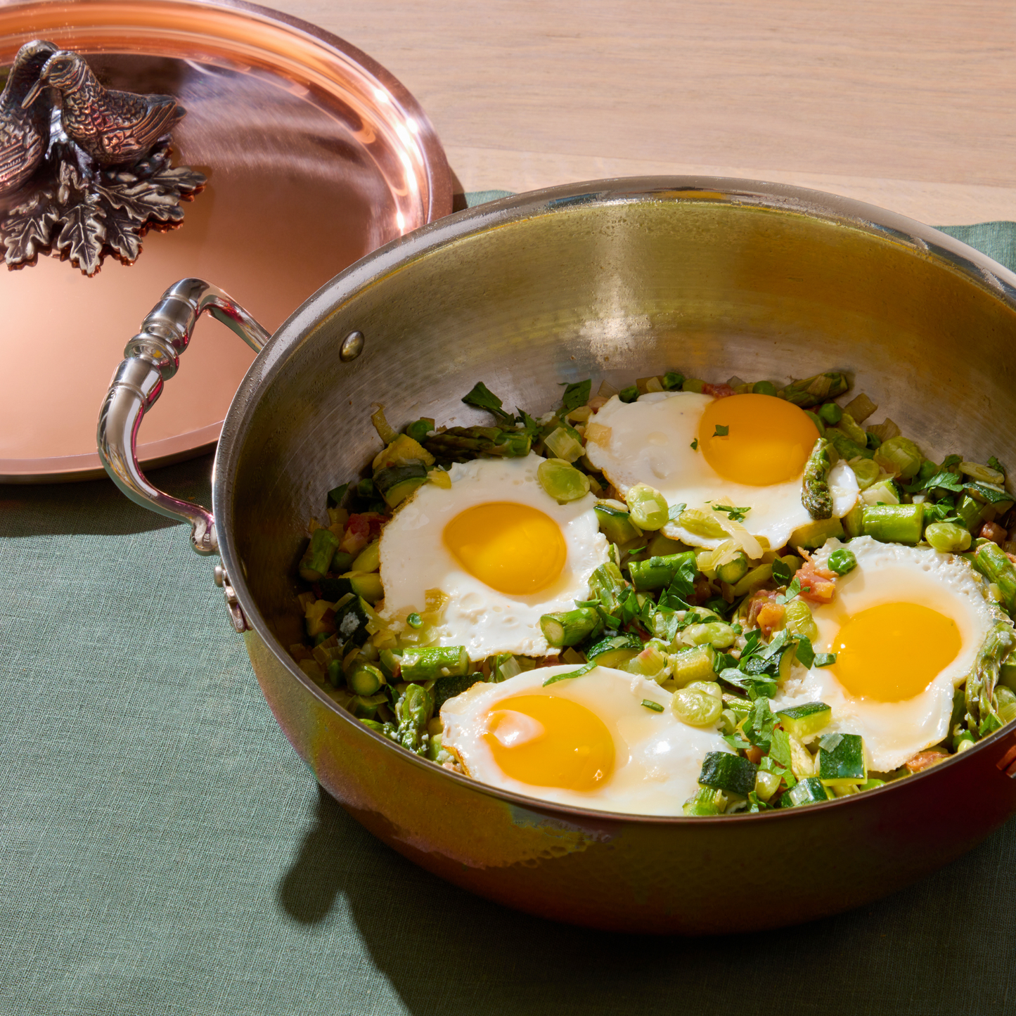 Green Shakshuka in an Opus Cupra hammered copper pot with a stainless steel lining and a silver-plated lid knob finial.
