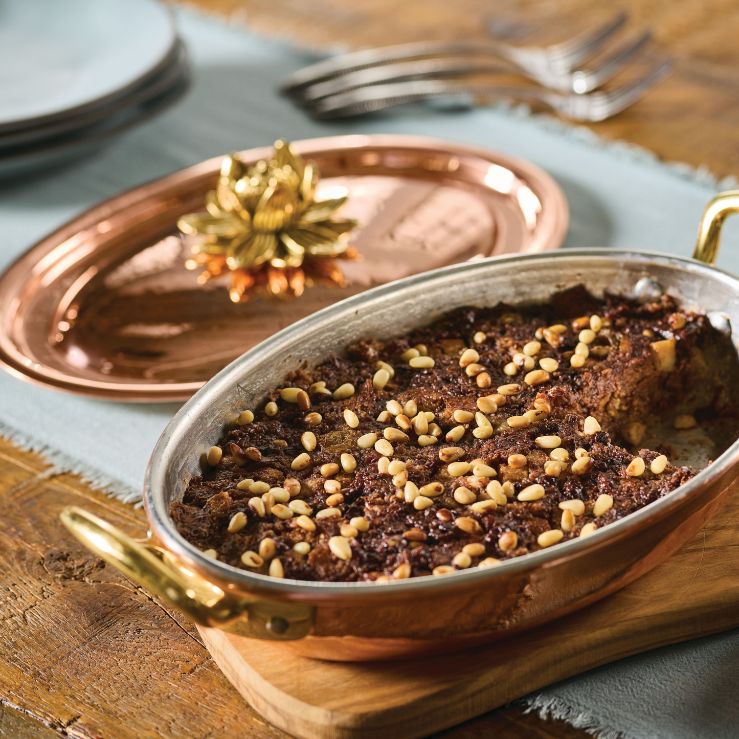 Italian cake prepared and served in the Glamstore Historia Lotus 10" Covered  Oval Gratin 