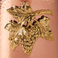 detail of the bronze grape medallioni copper utensil holder