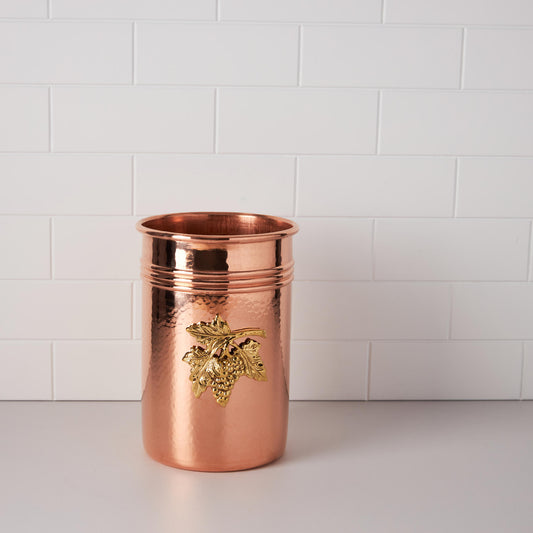 Container for kitchen utensils, made of solid copper, decorated with a bronze plaque depicting grapes,
