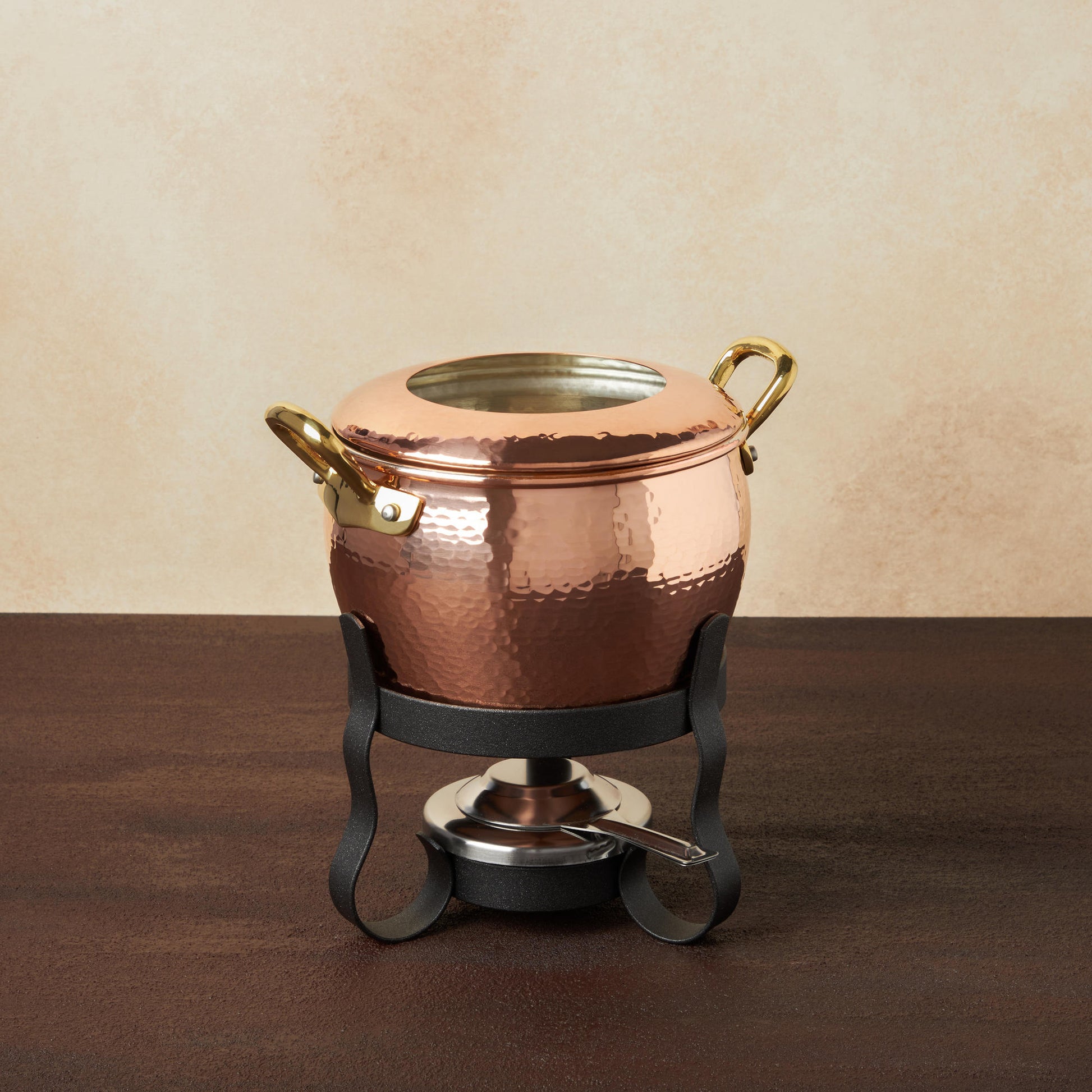 Hammered copper Fondue Michelle Set from the Glamstore Historia collection. Lined with high purity tin applied by hand over fire and adorned with bronze handles.