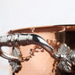 Beautiful stainless steel handle decorated with delicate leaves on Opus Cupra cookware