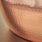 Signature hammering finish on copper 6 Qt Braiser from Glamstore Historia, applied to ensure increased strength and lasting beauty
