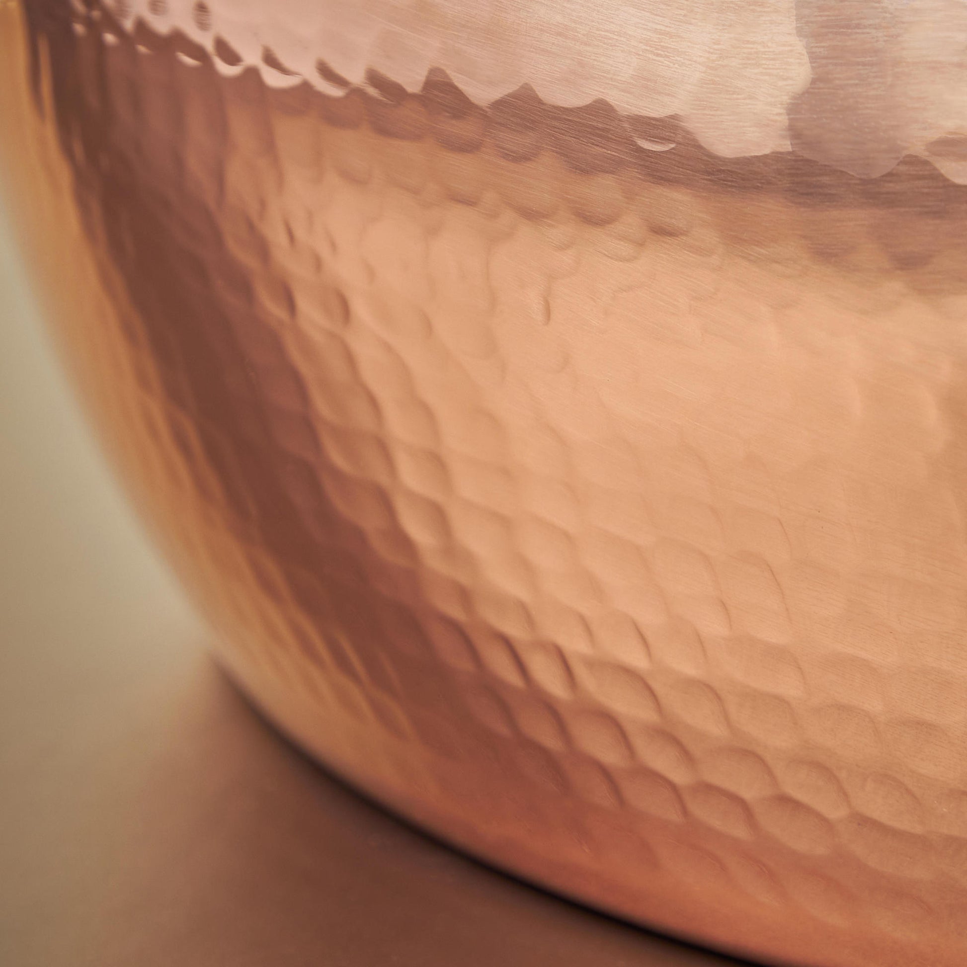 Signature hammering finish on copper 6 Qt Braiser from Glamstore Historia, applied to ensure increased strength and lasting beauty