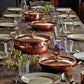 Hammered copper 6 Qt Braiser lined with high purity tin applied by hand over fire and bronze handles, from Glamstore Historia collection