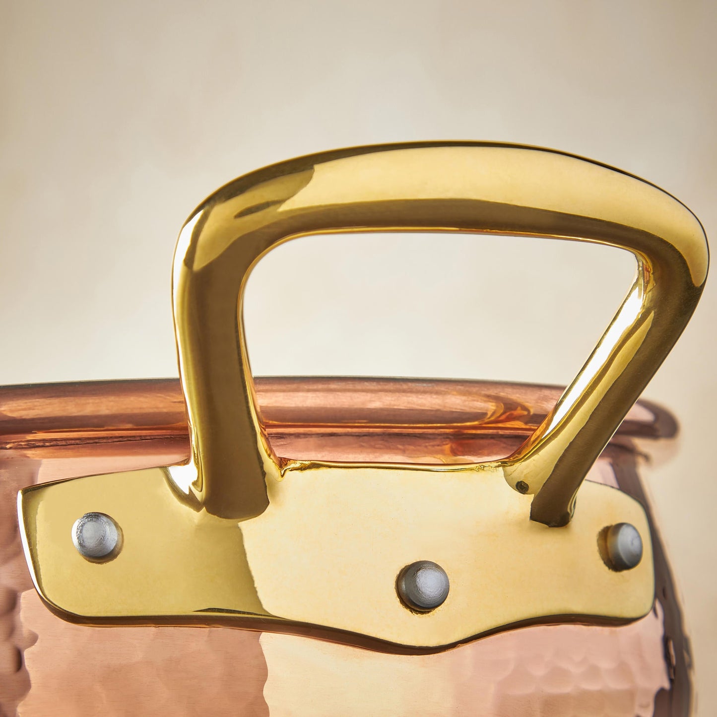 Beautiful bronze handle on Historia hammered copper cookware