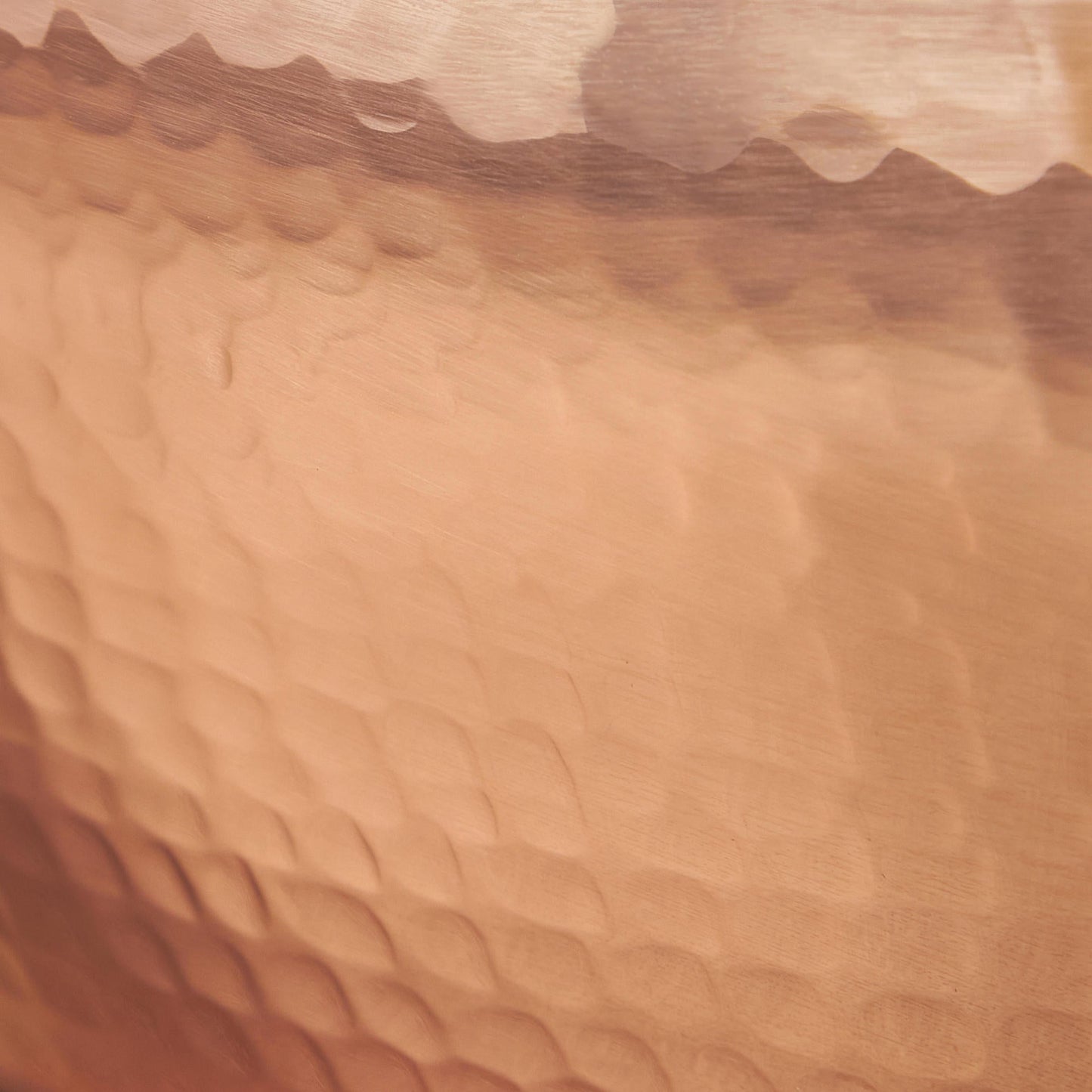 Signature hammering finish on copper 11" Double Handle Fry Pan from Glamstore Historia, applied to ensure increased strength and lasting beauty