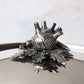 Decorated knob finial representing fennel, carrot and bean, cast in solid bronze and silver plated, on Opus Prima stainless steel lid