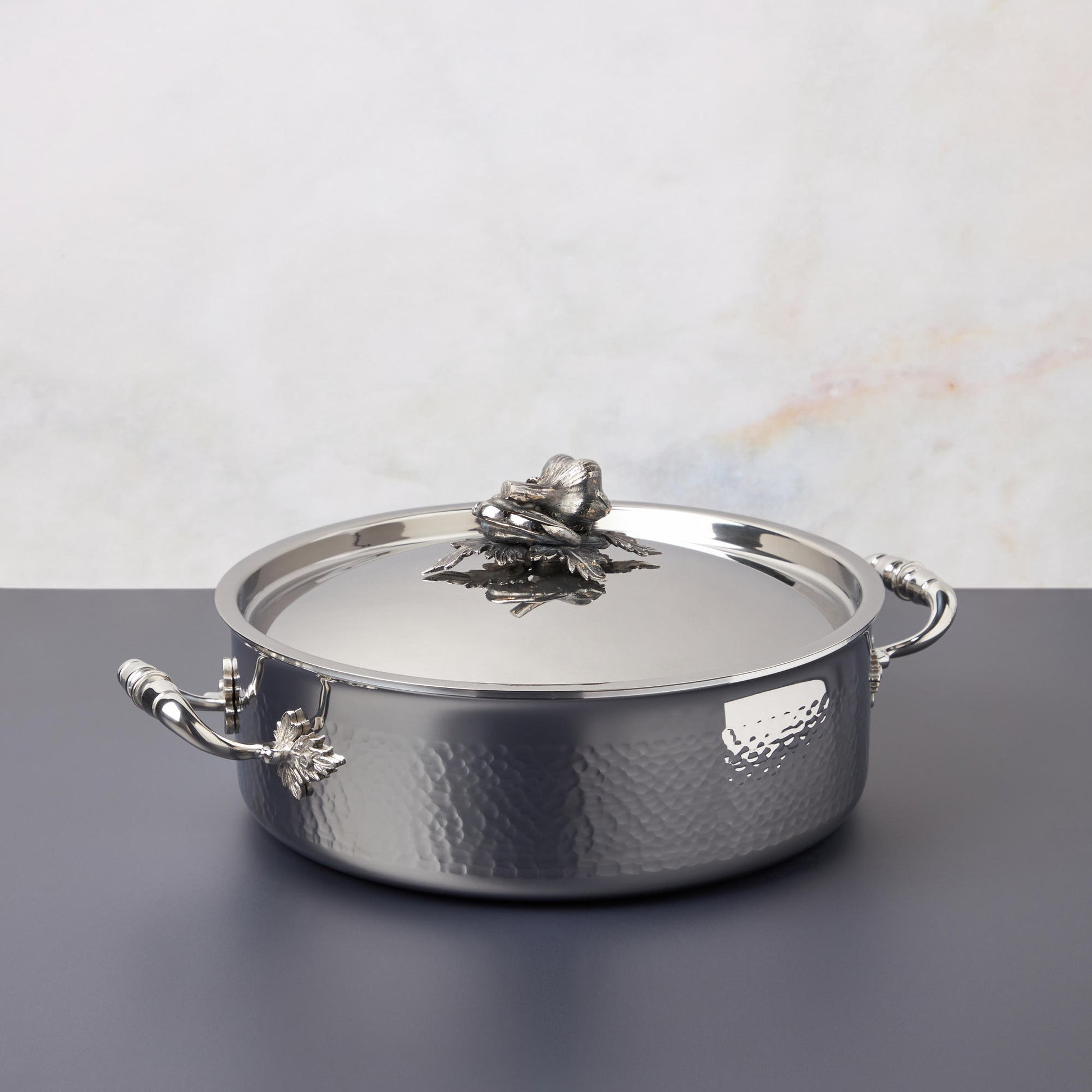 Opus Prima braiser in hammered clad stainless steel with decorated lid and handles