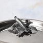 Decorated knob finial representing carrot and pepper, cast in solid bronze and silver plated, on Opus Prima stainless steel lid