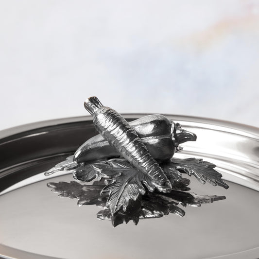 Decorated knob finial representing carrot and pepper, cast in solid bronze and silver plated, on Opus Prima stainless steel lid