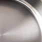 Sunray polished and hammered stainless steel lining in saucepan