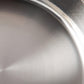 Sunray polished and hammered stainless steel lining in saucepan