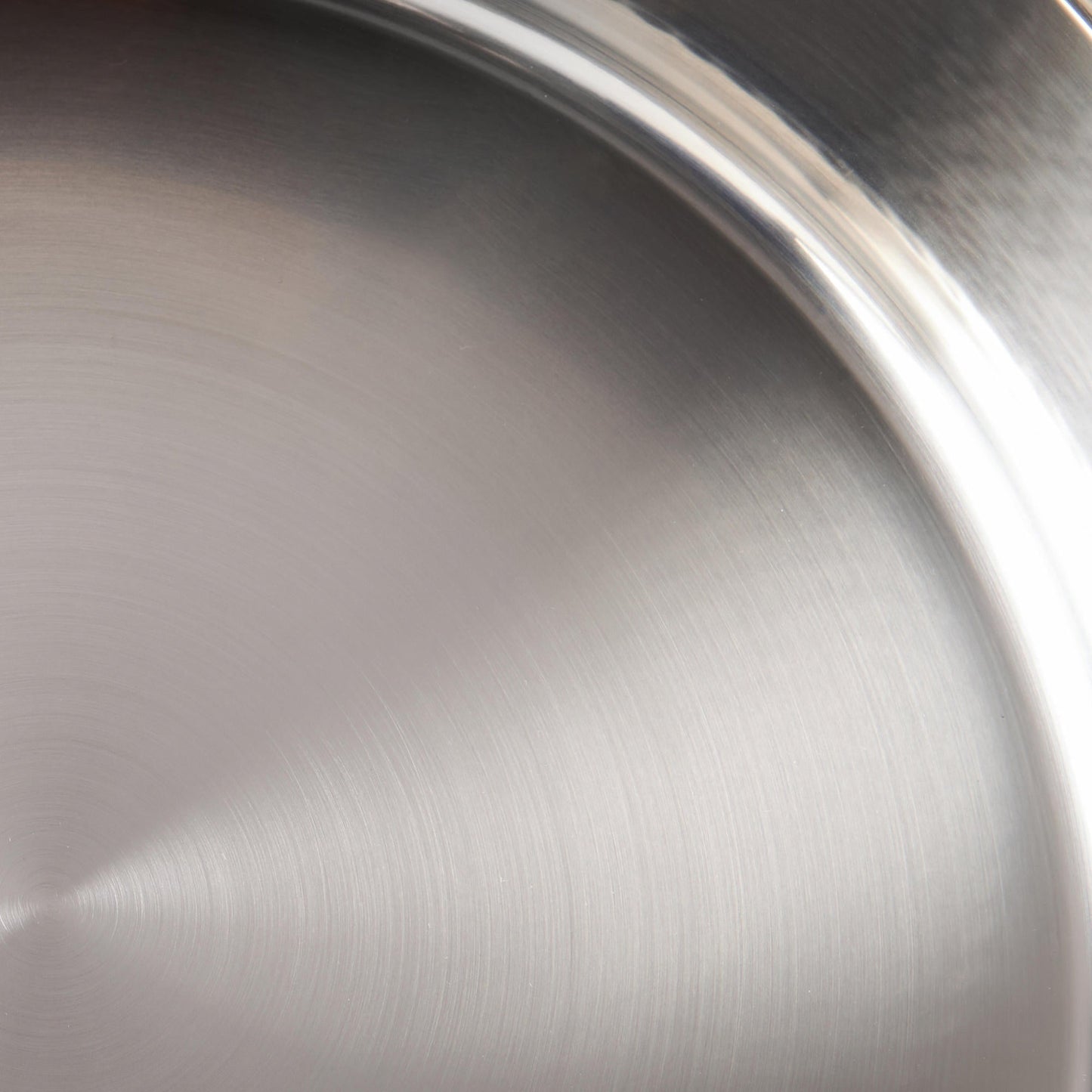Sunray polished and hammered stainless steel lining in saucepan
