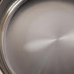 Sunray polished and hammered stainless steel lining in saucepan