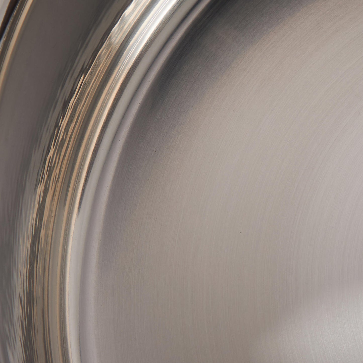 Sunray polished and hammered stainless steel lining in saucepan