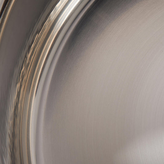 Sunray polished and hammered stainless steel lining in saucepan