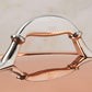 Comfortable lid handle in stainless steel with decorative inlaid copper coin