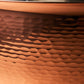 Hammering increases strength and beauty of copper clad with stainless steel sauté 