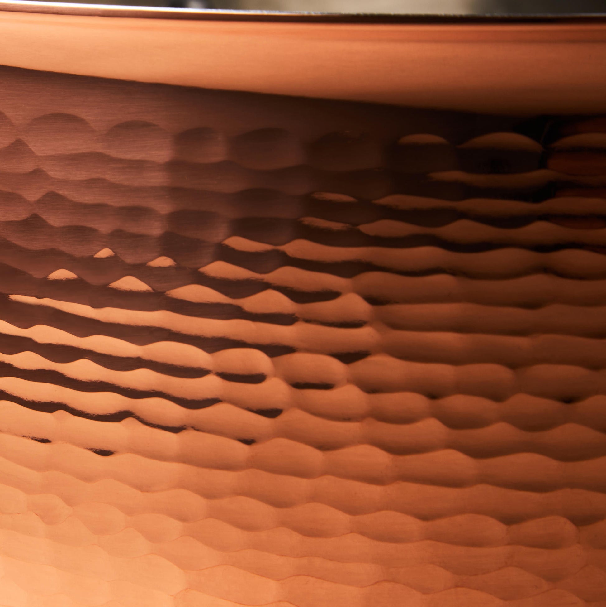 Hammering increases strength and beauty of copper clad with stainless steel sauté 