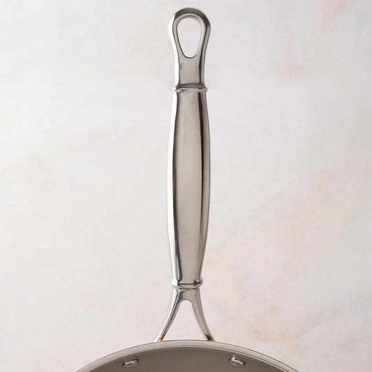 Comfortable stainless steel long stick handle with decorative inlaid copper coin