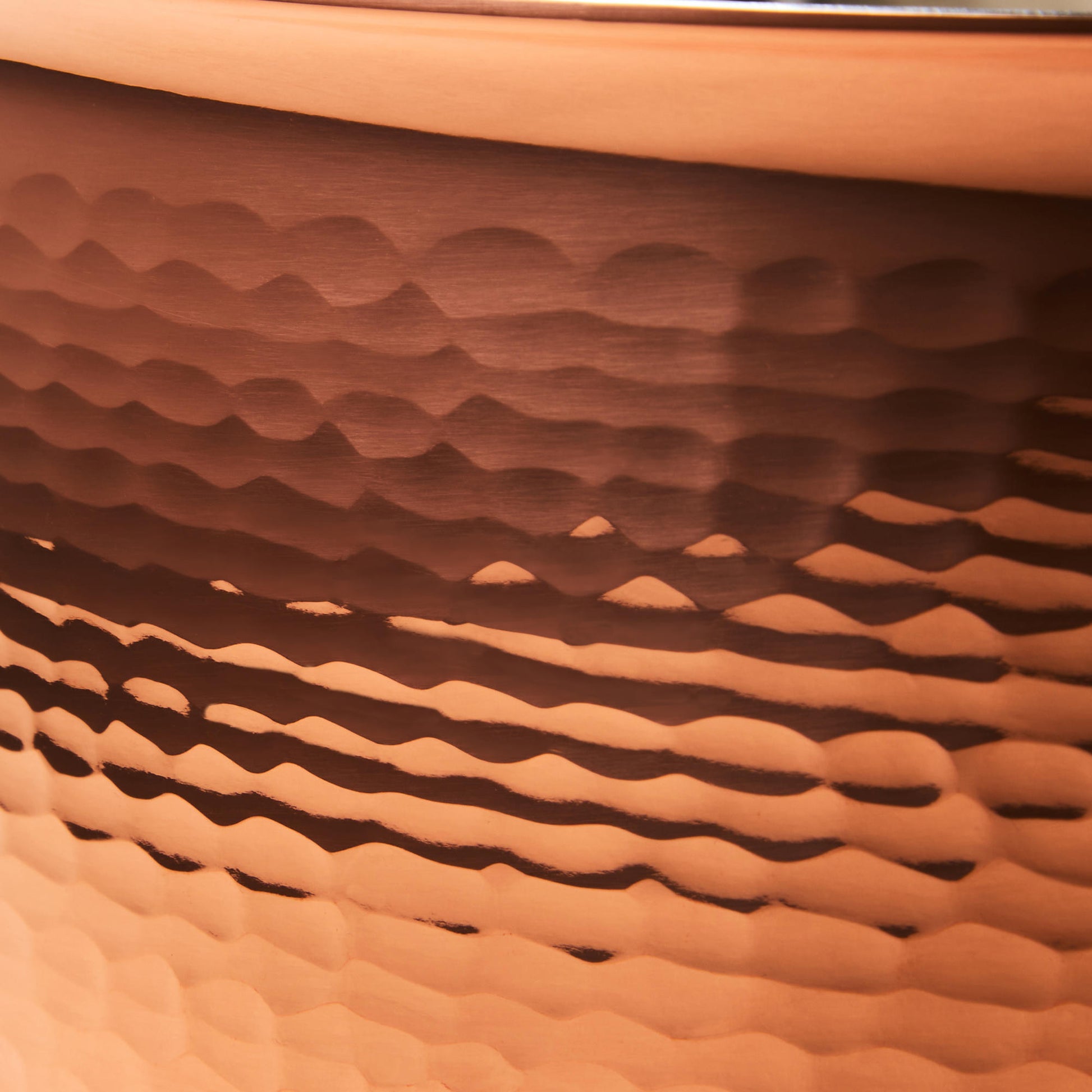 Hammering increases strength and beauty of copper clad with stainless steel  saucepot