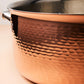 Hammering increases strength and beauty of copper clad with stainless steel cookware