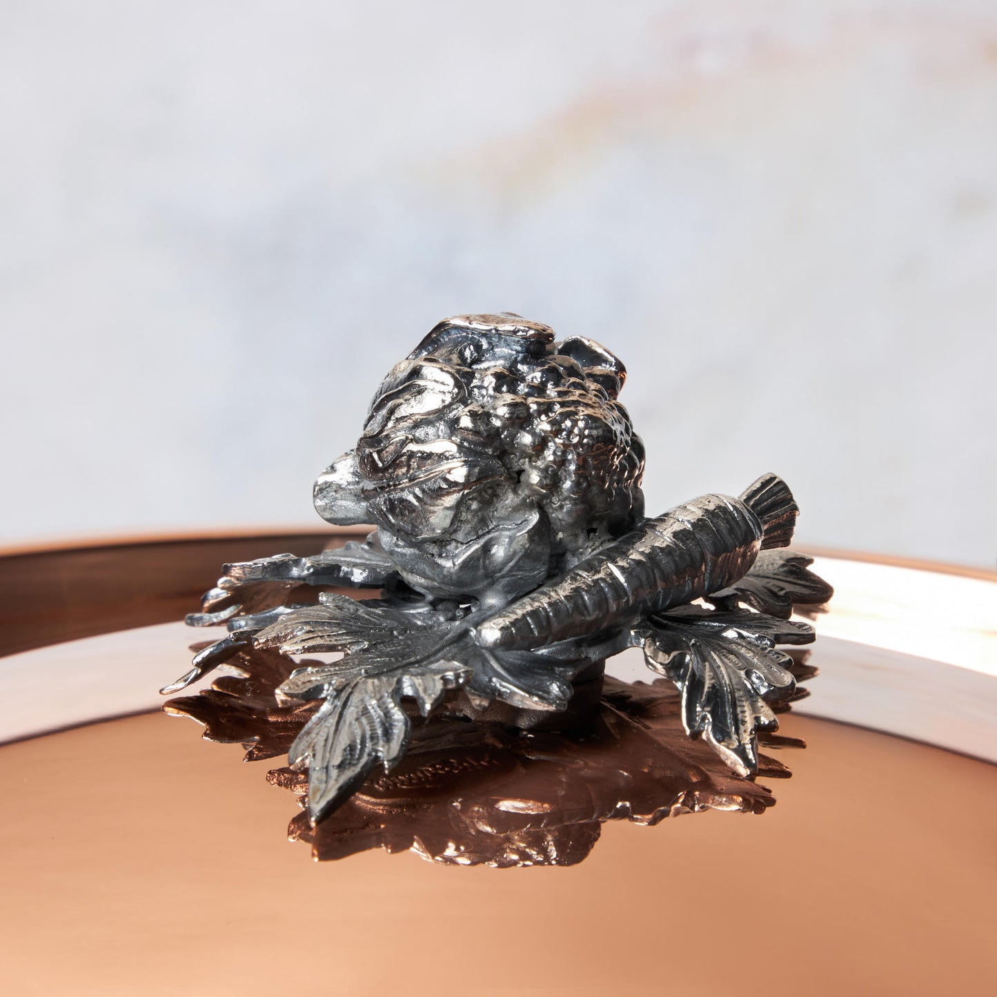 Decorated knob finial representing cauliflower and carrot, cast in solid bronze and silver plated, on Opus Cupra clad copper lid