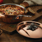 Opus Cupra hammered copper chef pan with stainless steel lining and decorated silver-plated lid knob finial  used to serve Italian spaghetti
