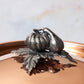 Decorated knob finial representing pumpkin and gourd, cast in solid bronze and silver plated, on Opus Cupra clad copper lid
