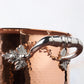 Beautiful stainless steel handle decorated with delicate leaves on Opus Cupra cookware