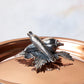 Decorated knob finial representing carrot and pepper, cast in solid bronze and silver plated, on Opus Cupra clad copper lid