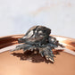 Decorated knob finial representing artichoke and carrot, cast in solid bronze and silver plated, on Opus Cupra clad copper lid