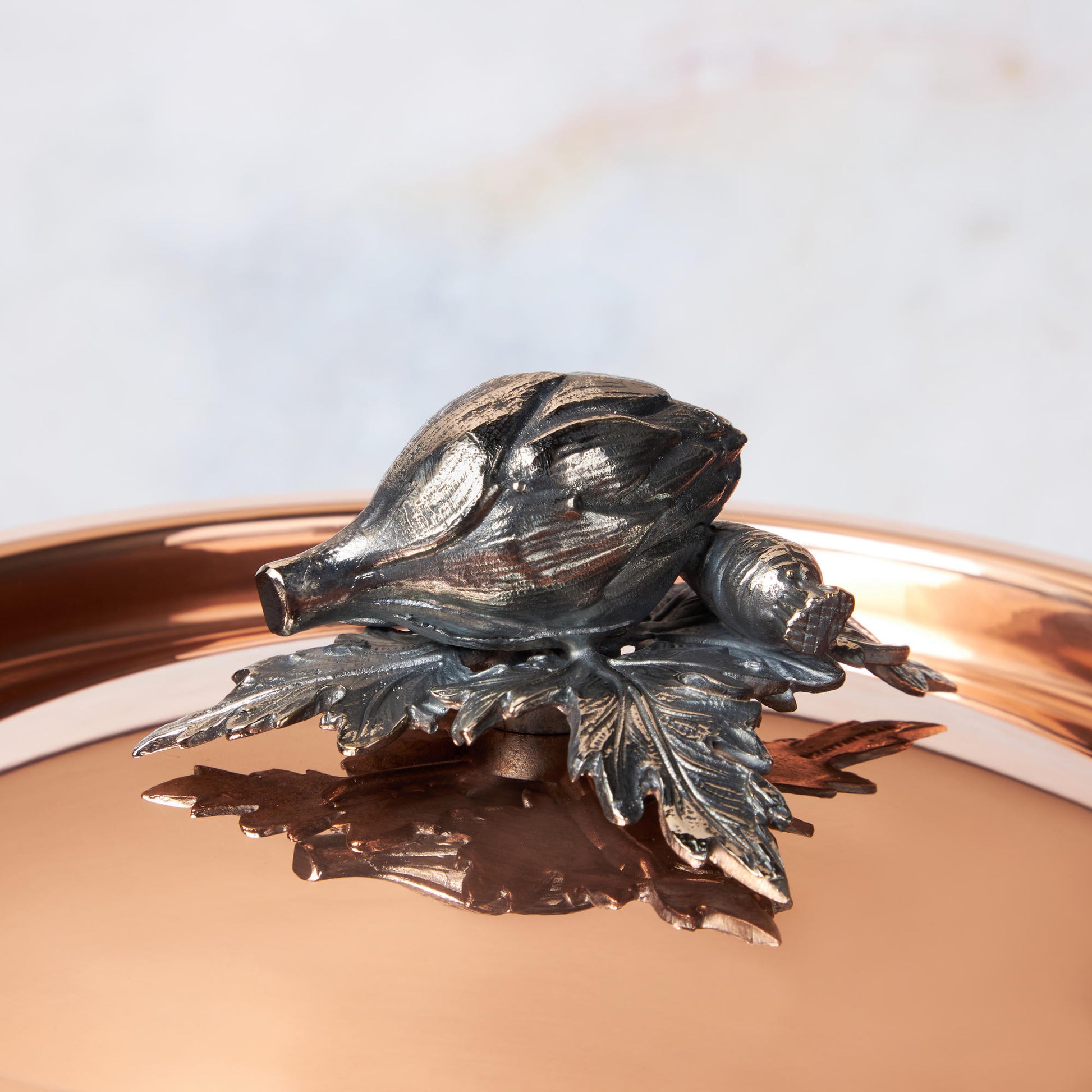 Decorated knob finial representing artichoke and carrot, cast in solid bronze and silver plated, on Opus Cupra clad copper lid