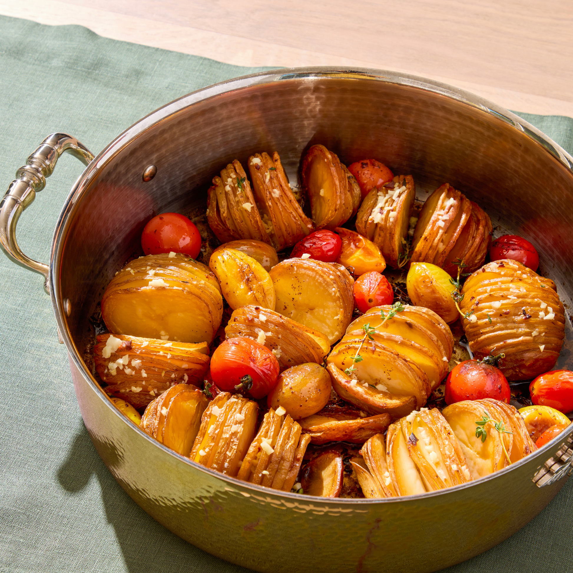 Hasselback Potatoes in an Opus Cupra braiser hammered copper with stainless steel lining and decorated silver-plated lid knob finial.