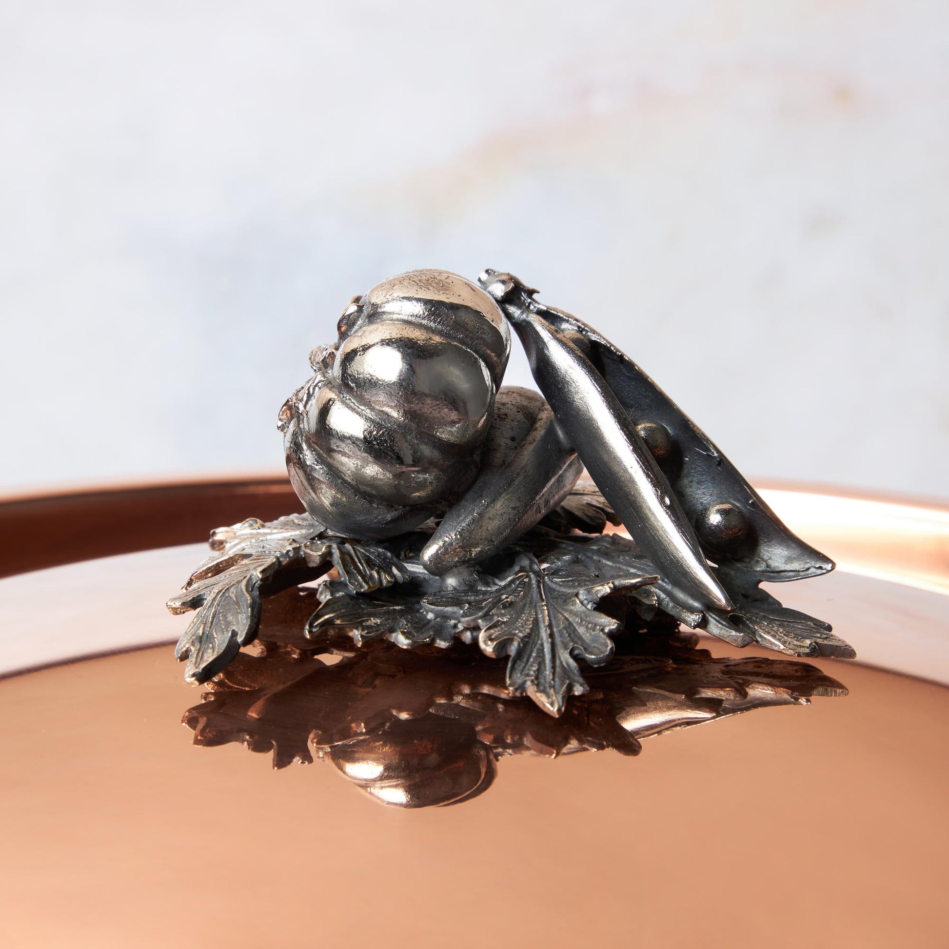 Decorated knob finial representing tomato, pepper and peas, cast in solid bronze and silver plated, on Opus Cupra clad copper lid