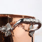 Beautiful stainless steel helper handle decorated with delicate leaves on Opus Cupra cookware