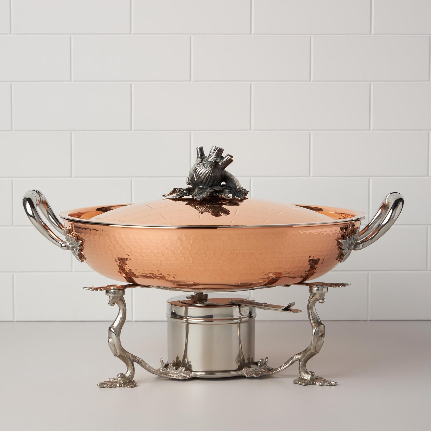 stainless steel warming stand for gel and candle photographed with a matching Opus Cupra serving frying pan