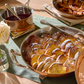 French toast baked in an Opus Cupra hammered copper with stainless steel lining and decorated silver-plated lid knob finial.