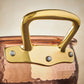 Beautiful bronze handle on Historia hammered copper cookware