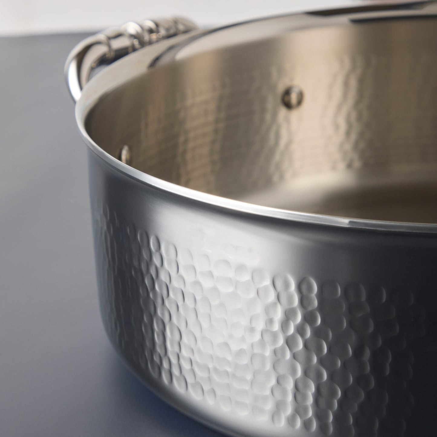 Hammering increases strength and beauty of clad stainless steel