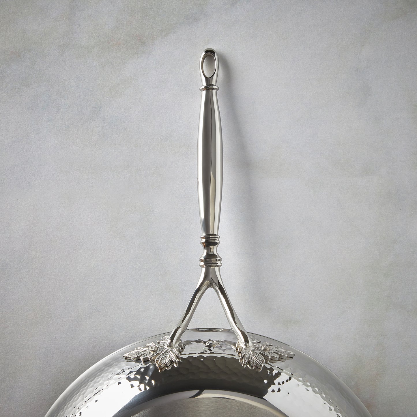 Beautiful stainless steel long stick handle decorated with delicate leaves on Opus Prima cookware