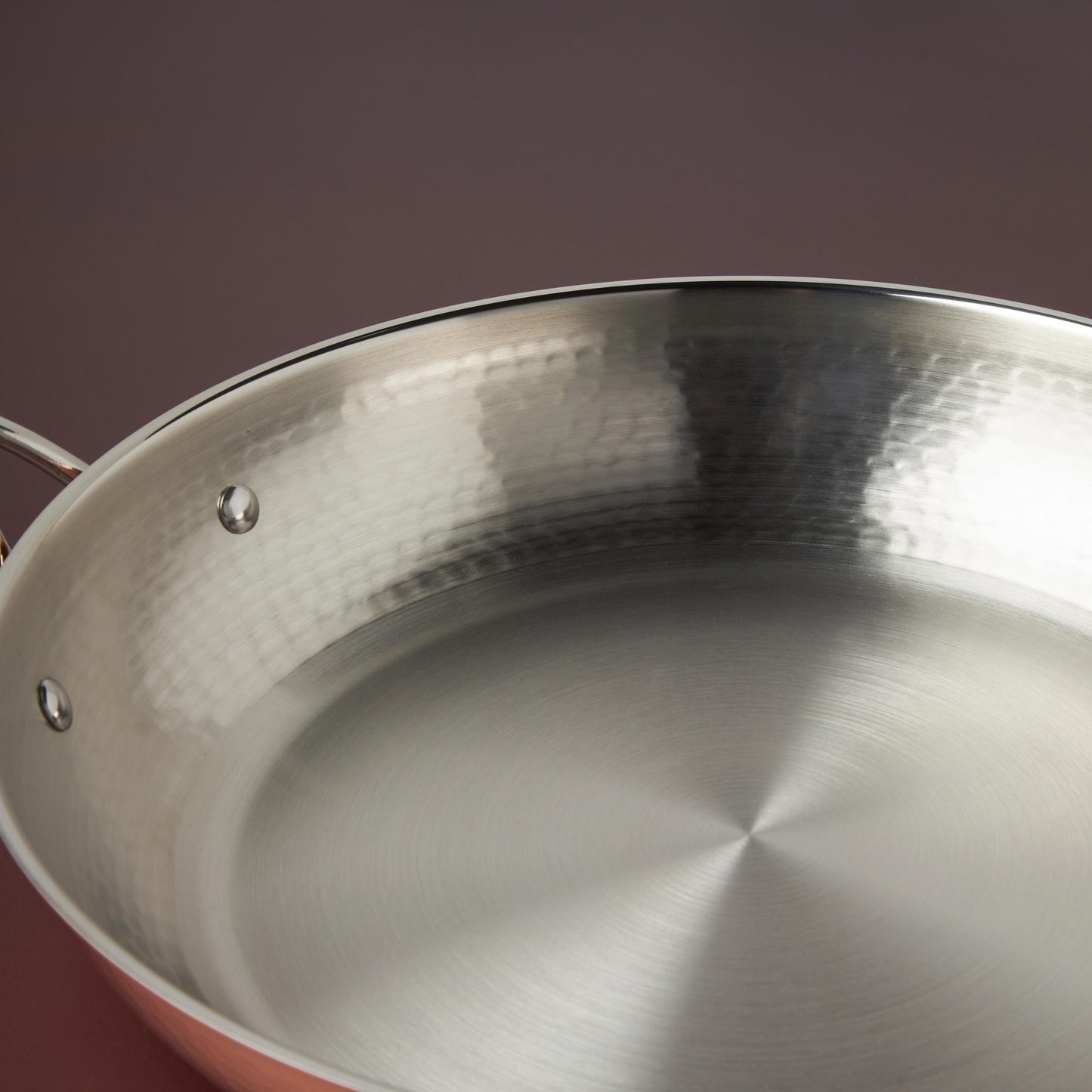 Sunray polished and hammered stainless steel lining in Opus Cupra skillet
