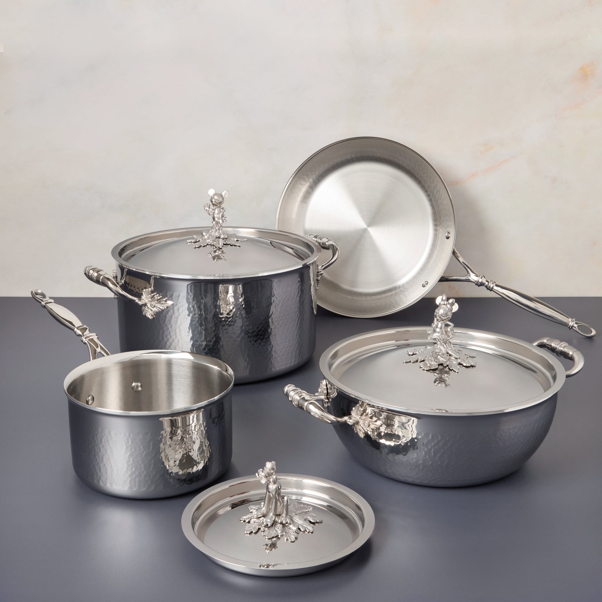 7-piece set  Opus Prima hammered clad stainless steel with special edition Disney-inspired knobs in stainless steel featuring Mickey Mouse, Minnie Mouse, and Pluto